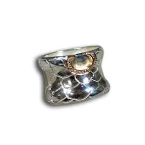 anello argento, canale oro e brillanti